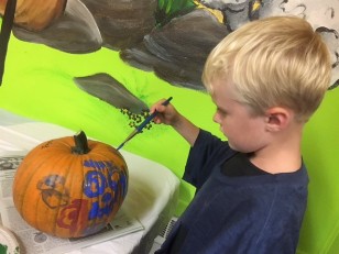 Painting pumpkins.